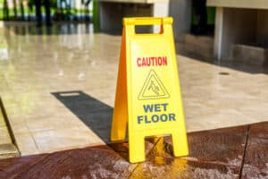 Caution wet floor sign placed to prevent slip and fall accidents